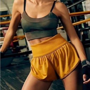 NWOT free people movement mustard yellow flowy workout Game Time shorts